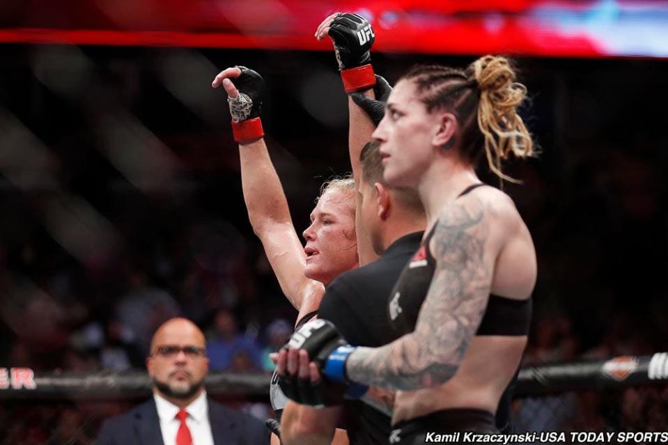 Jun 9, 2018; Chicago, IL, USA;  Holly Holm (red gloves) defeats Megan Anderson (blue gloves) during UFC 225 at United Center. Mandatory Credit: Kamil Krzaczynski-USA TODAY Sports