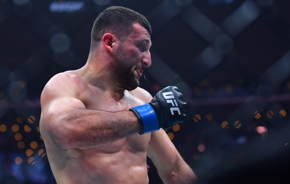 Jan 18, 2025; Inglewood, California, USA; Azamat Bekoev (blue gloves) reacts after defeating Zachary Reese (not pictured) during UFC 311 at Intuit Dome. Mandatory Credit: Gary A. Vasquez-Imagn Images