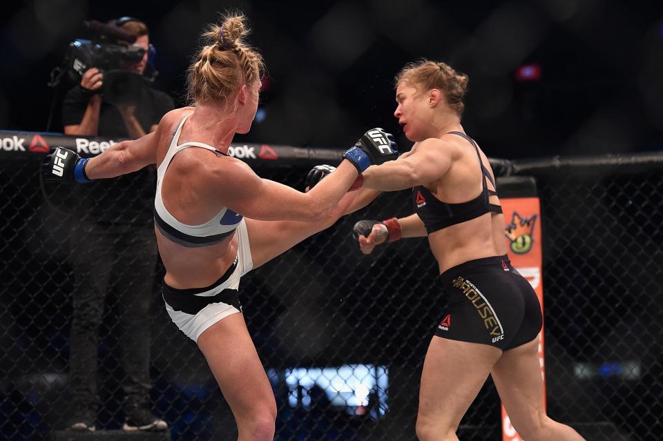 Nov 15, 2015; Melbourne, Australia; Ronda Rousey (red gloves) competes against Holly Holm (blue gloves) during UFC 193 at Etihad Stadium. Mandatory Credit: Matt Roberts-USA TODAY Sports