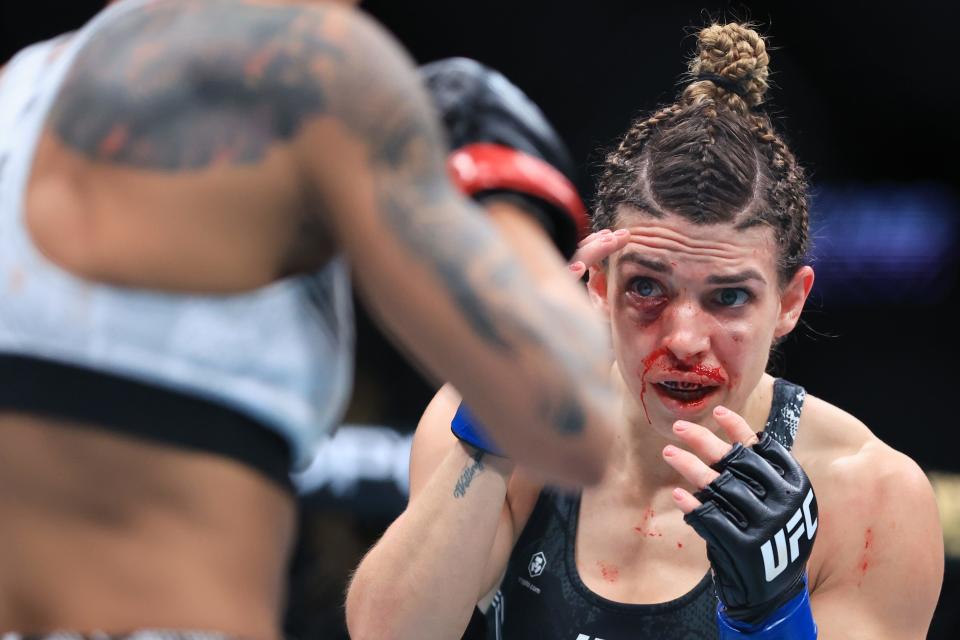 ANAHEIM, CALIFORNIA - FEBRUARY 17: Amanda Lemos of Brazil  exchanges strikes with Mackenzie Dern in their women's strawweight fight during UFC 298 at Honda Center on February 17, 2024 in Anaheim, California. (Photo by Sean M. Haffey/Getty Images)