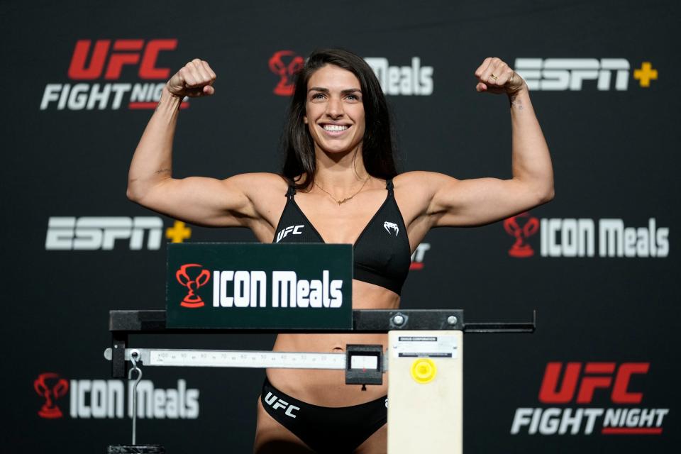 LAS VEGAS, NEVADA - OCTOBER 08:  In this UFC handout,  Mackenzie Dern poses on the scale during the UFC Fight Night weigh-in at UFC APEX on October 08, 2021 in Las Vegas, Nevada. (Photo by Jeff Bottari/Zuffa LLC/Getty Images)