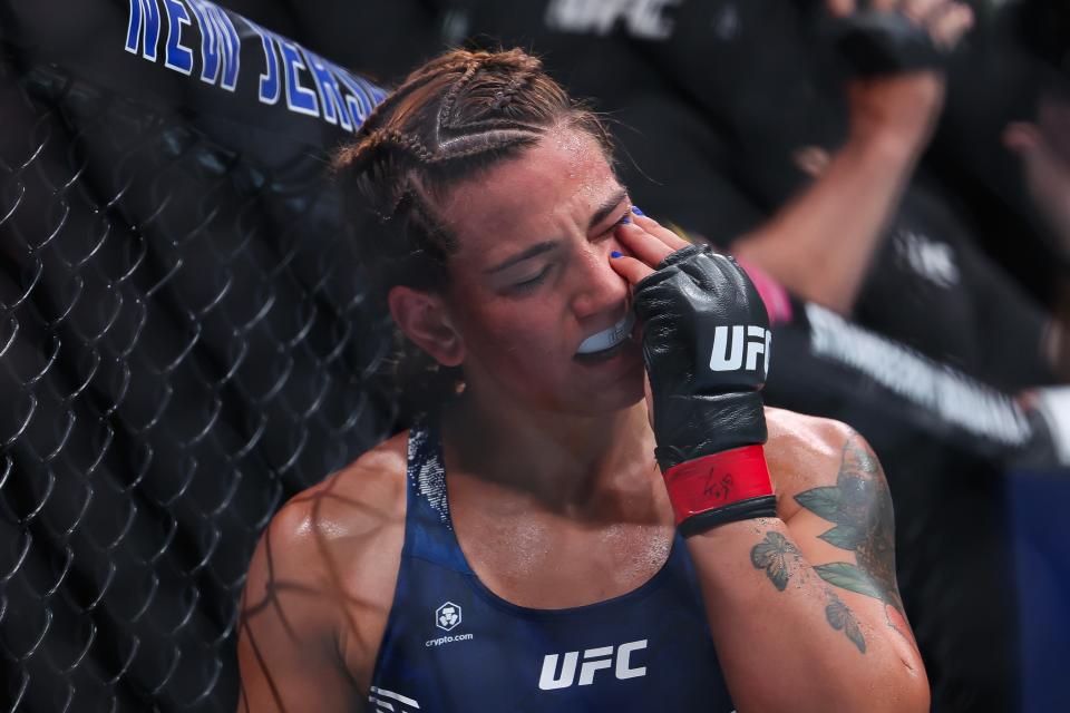 NEWARK, NEW JERSEY - JUNE 01: Ailin Perez of Argentina reacts after a strike by Joselyne Edwards of Panama in their bantamweight bout during UFC 302 at Prudential Center on June 01, 2024 in Newark, New Jersey. (Photo by Luke Hales/Getty Images)