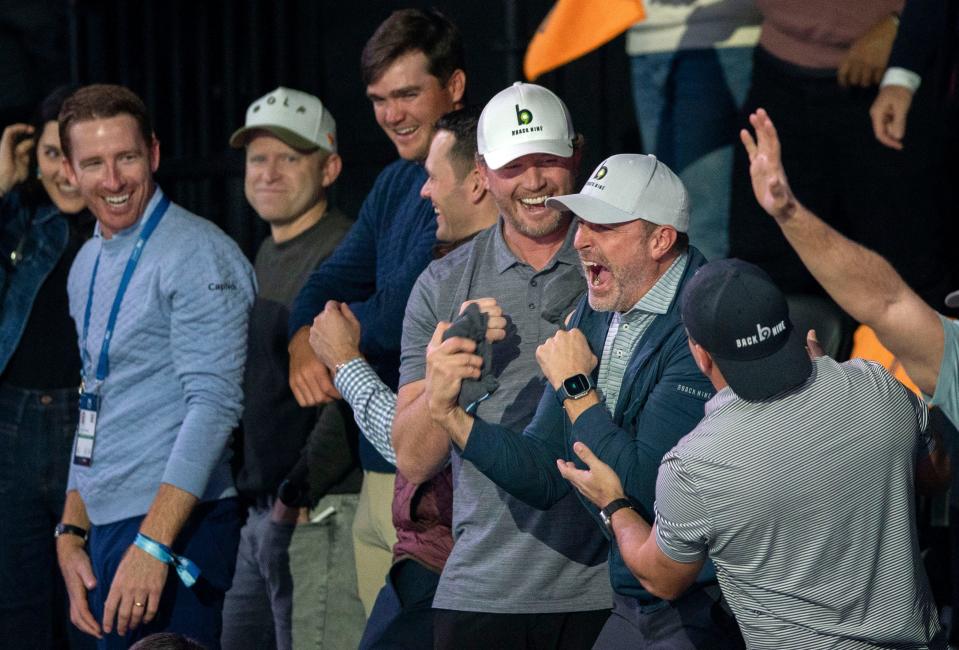 Fans catch merchandise during the inaugural golf match at SoFi Center, the home of TGL, the interactive golf league founded by Tiger Woods and Rory McIlroy on January 7, 2025 in Palm Beach Gardens, Florida.