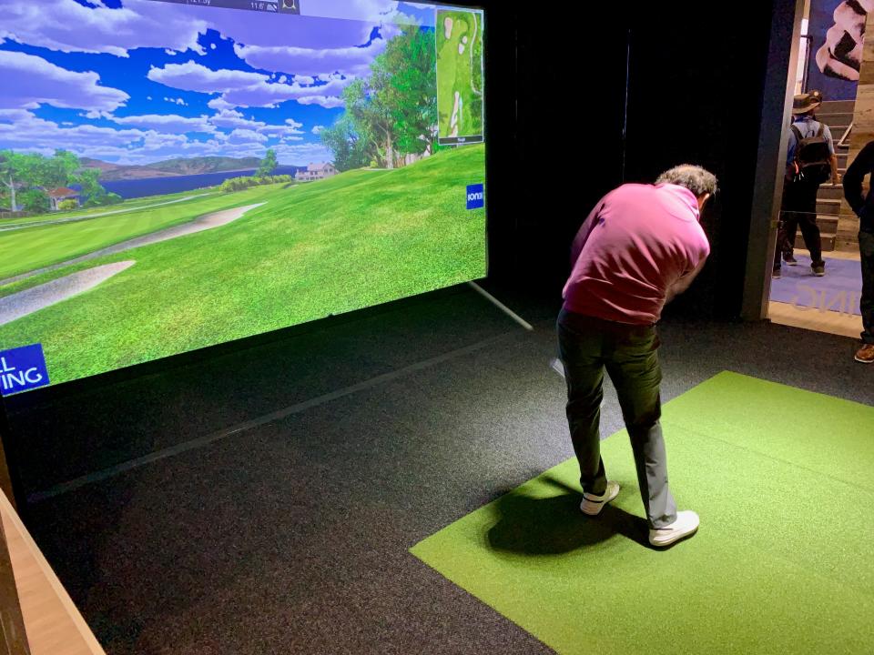 A golf simulator in action at the 2019 PGA Merchandise Show.