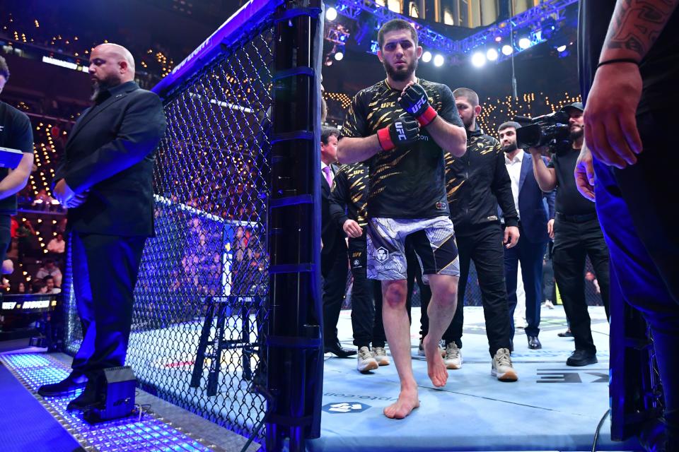 Jan 18, 2025; Inglewood, California, USA; Islam Makhachev (red gloves) leaves the octagon after defeating Renato Moicano (not pictured) in a lightweight title fight during UFC 311 at Intuit Dome. Mandatory Credit: Gary A. Vasquez-Imagn Images