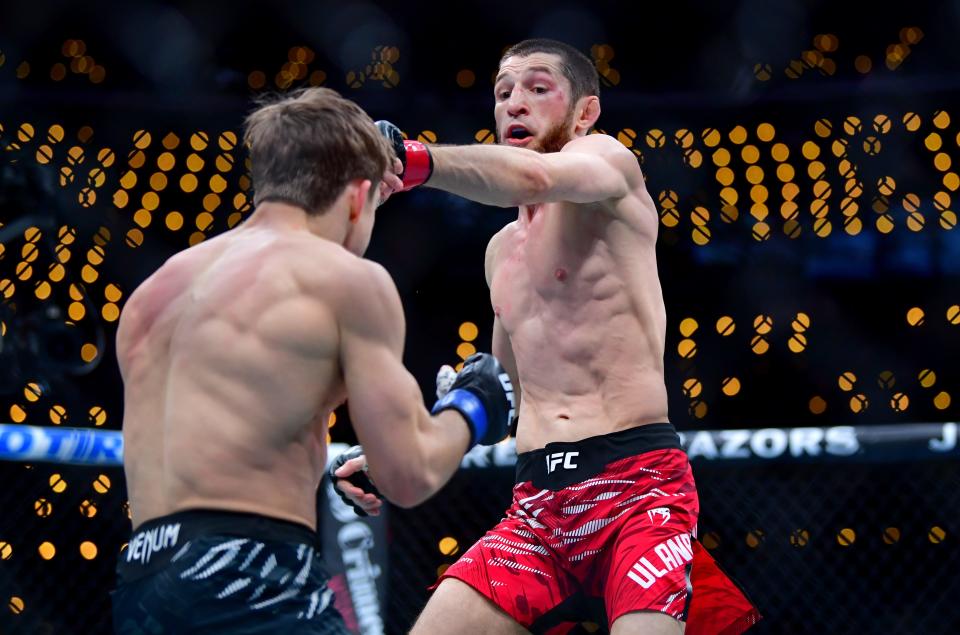 Jan 18, 2025; Inglewood, California, USA; Tagir Ulanbekov (red gloves) fights Clayton Carpenter (blue gloves) during UFC 311 at Intuit Dome. Mandatory Credit: Gary A. Vasquez-Imagn Images