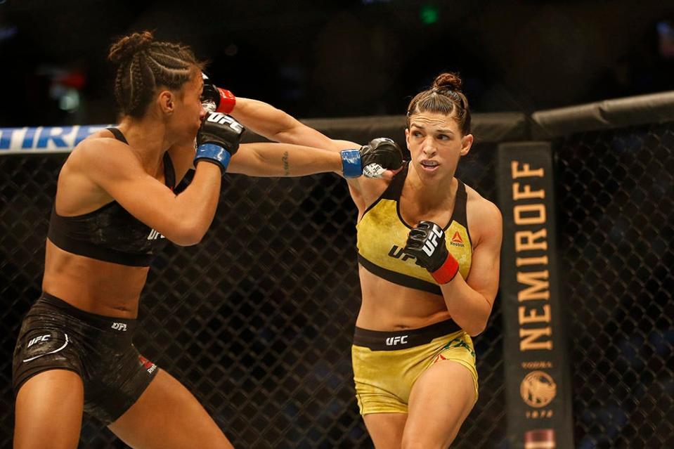 Oct 12, 2019; Tampa, FL, USA; Mackenzie Dern (red gloves) fights Amanda Ribas (blue glove) during UFC Fight Night at Amalie Arena. Mandatory Credit: Reinhold Matay-USA TODAY Sports