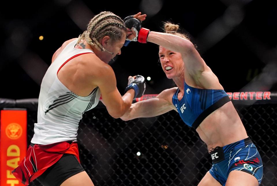 Mar 25, 2023; San Antonio, Texas, USA; Holly Holm (red gloves) fights Yana Santos (blue gloves) during UFC Fight Night at AT&T Center. Mandatory Credit: Aaron Meullion-USA TODAY Sports