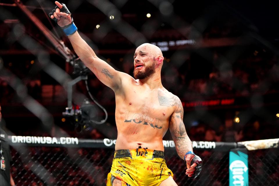 Jul 13, 2024; Denver, Colorado, USA; Jean Silva (blue gloves) celebrates defeating Drew Dober (red gloves) during UFC Fight Night at Ball Arena. Mandatory Credit: Ron Chenoy-USA TODAY Sports