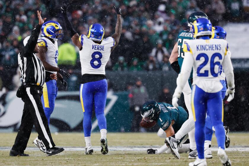 PHILADELPHIA, PA - JANUARY 19: Los Angeles Rams linebacker Jared Verse, center, reacts after sacking Philadelphia Eagles quarterback Jalen Hurts during the second quarter during an NFC divisional round at Lincoln Financial Field on Sunday, Jan. 19, 2025 in Philadelphia, PA. (Gina Ferazzi / Los Angeles Times)