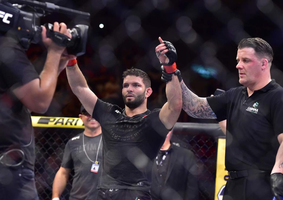 May 11, 2019; Rio de Janeiro, Brazil; Thiago Moises (red gloves) reacts to fight against Kurt Holobaugh (blue gloves) during UFC 237 at Jeunesse Arena. Mandatory Credit: Jason Silva-USA TODAY Sports