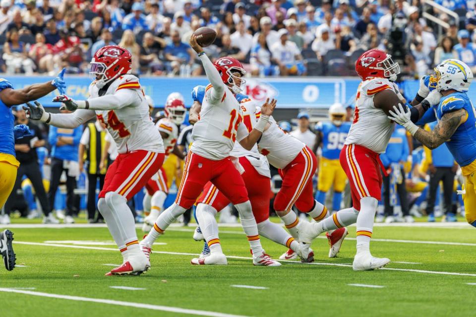 Chiefs quarterback Patrick Mahomes (15) lets his pass go in the pocket against the Chargers in September.