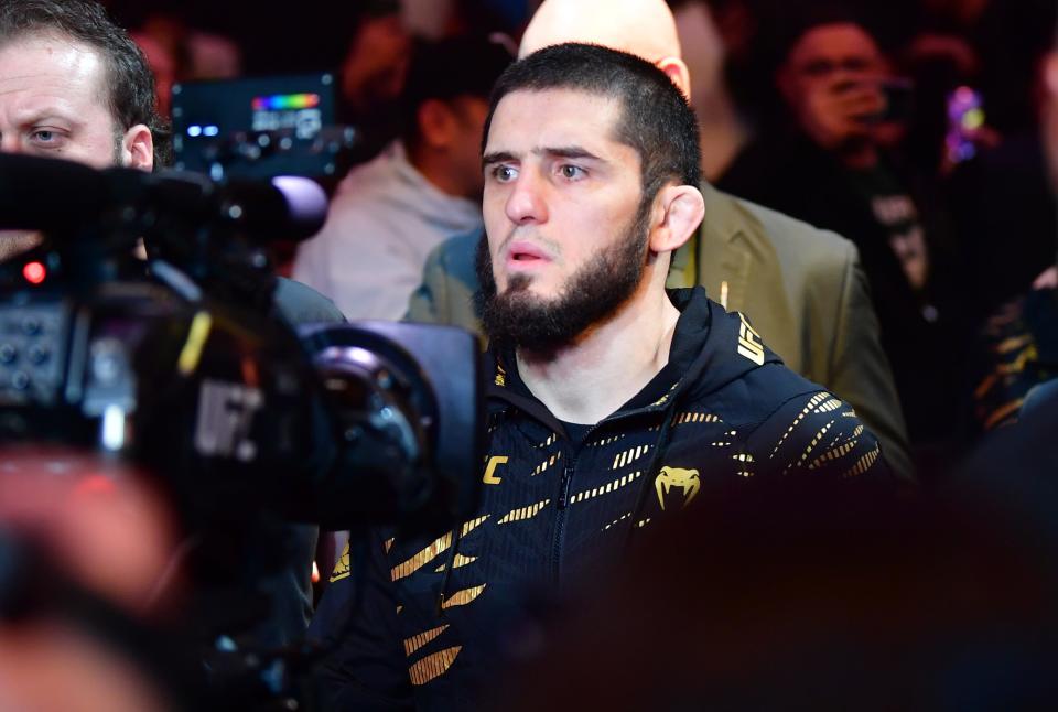 Jan 18, 2025; Inglewood, California, USA; Islam Makhachev (red gloves) walks out for a ightweight title fight against Renato Moicano (not pictured) during UFC 311 at Intuit Dome. Mandatory Credit: Gary A. Vasquez-Imagn Images