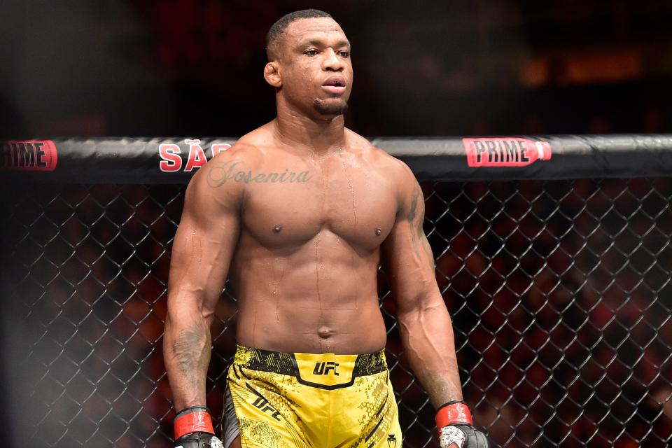 Nov 4, 2023; Sao Paulo, Brazil; Jailton Almeida (red gloves) fights Derrick Lewis (blue gloves) during UFC Fight Night at Ibirapuera Arena. Mandatory Credit: Jason da Silva-USA TODAY Sports