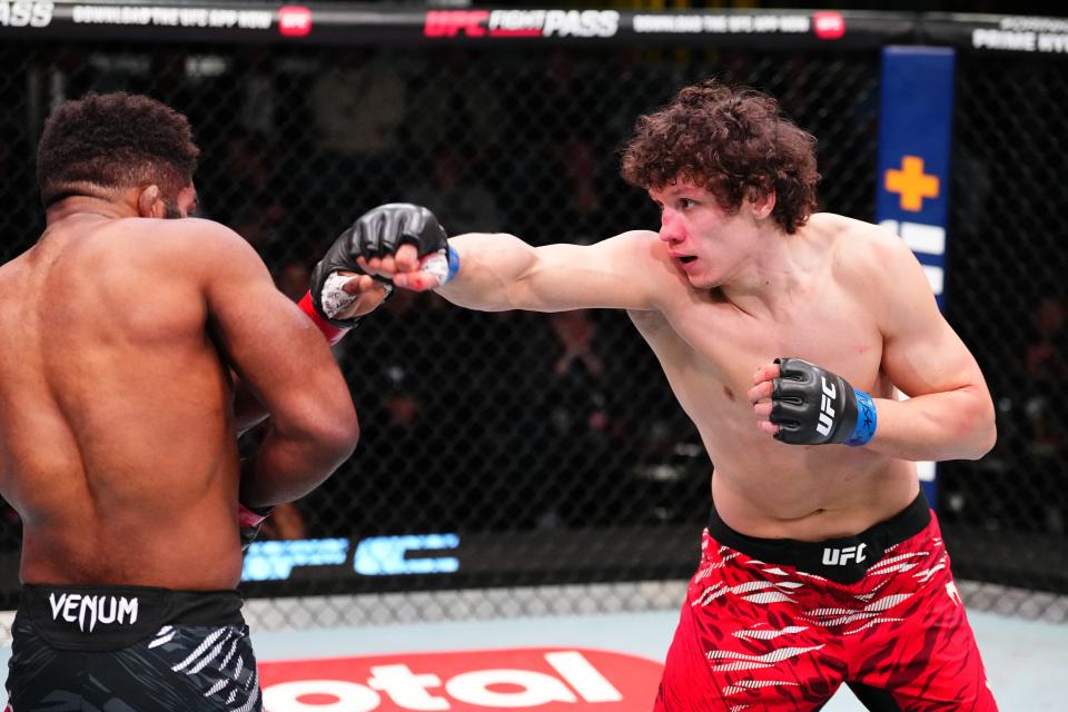 LAS VEGAS, NEVADA - JANUARY 11: (R-L) Roman Kopylov of Russia punches Chris Curtis in a middleweight fight during the UFC Fight Night event at UFC APEX on January 11, 2025 in Las Vegas, Nevada. (Photo by Chris Unger/Zuffa LLC via Getty Images)