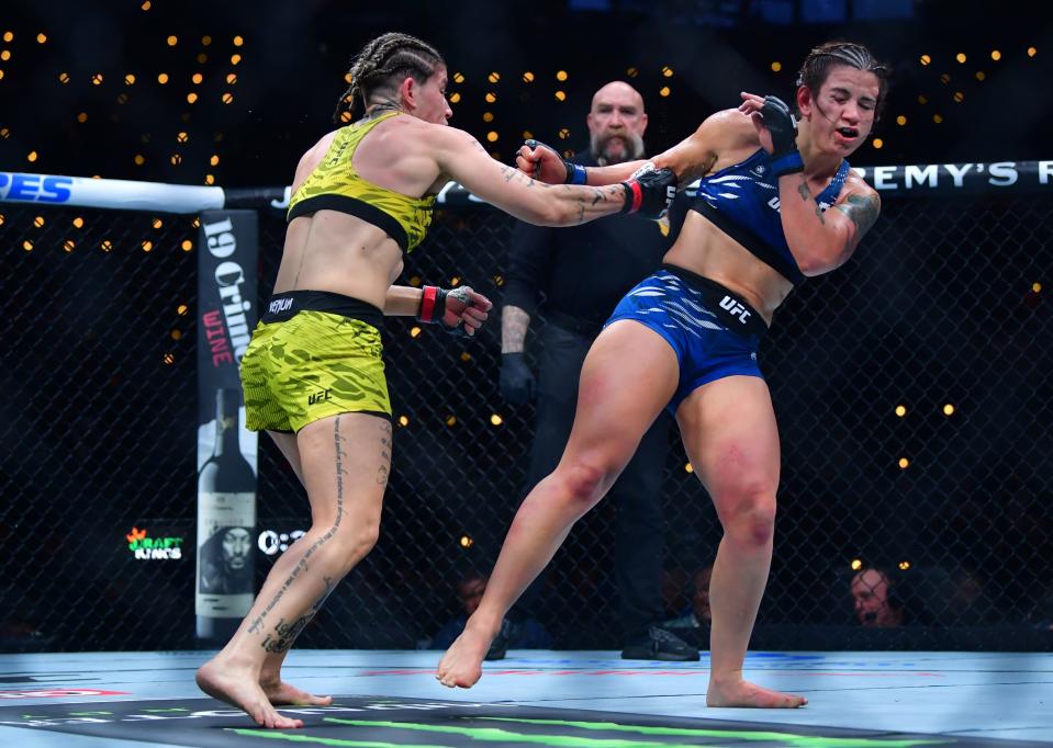 Jan 18, 2025; Inglewood, California, USA; Karol Rosa (red gloves) fights Ailin Perez (blue gloves) during UFC 311 at Intuit Dome. Mandatory Credit: Gary A. Vasquez-Imagn Images