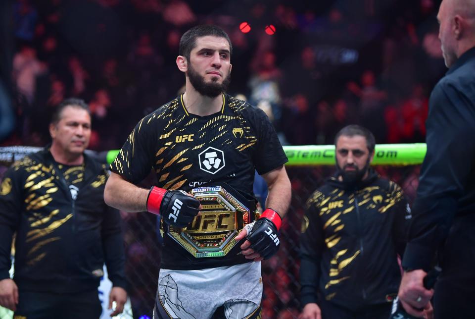 Jan 18, 2025; Inglewood, California, USA; Islam Makhachev (red gloves) reacts after defeating Renato Moicano (not pictured) in a lightweight title fight during UFC 311 at Intuit Dome. Mandatory Credit: Gary A. Vasquez-Imagn Images