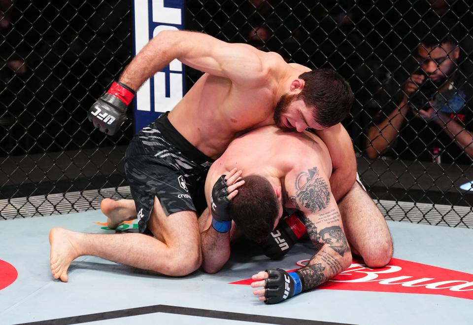 LAS VEGAS, NEVADA - JANUARY 11: (L-R) Nurullo Aliev of Tajikistan punches Joe Solecki in a lightweight fight during the UFC Fight Night event at UFC APEX on January 11, 2025 in Las Vegas, Nevada. (Photo by Chris Unger/Zuffa LLC via Getty Images)