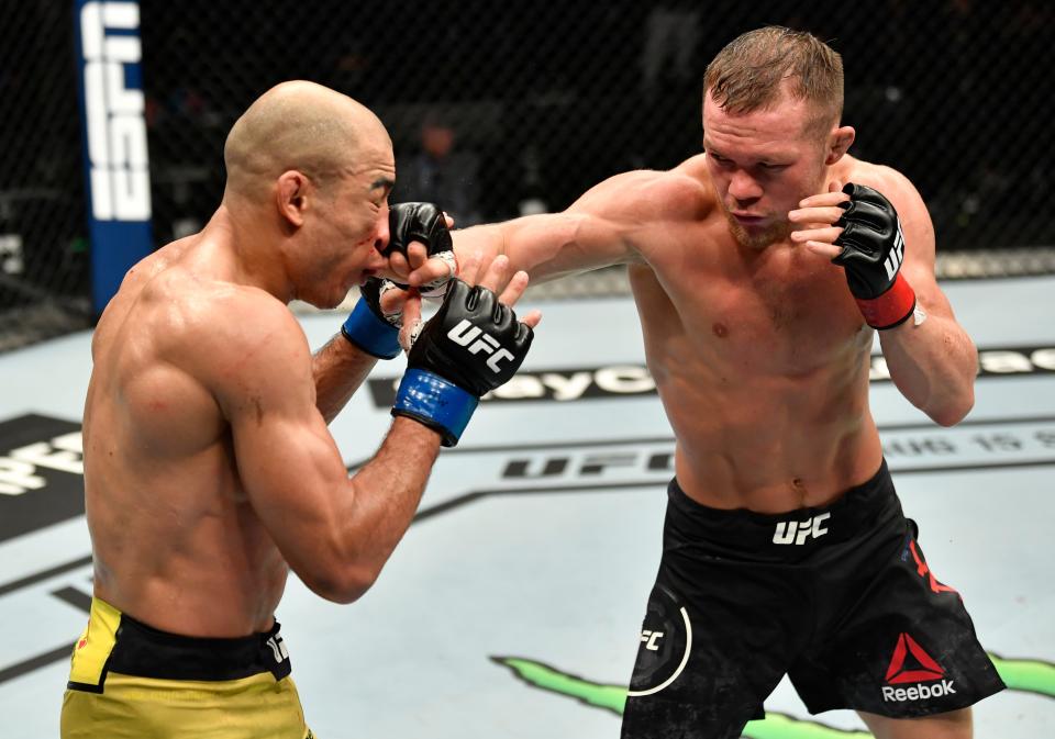 ABU DHABI, UNITED ARAB EMIRATES - JULY 12: (R-L) Petr Yan of Russia punches Jose Aldo of Brazil in their UFC bantamweight championship fight during the UFC 251 event at Flash Forum on UFC Fight Island on July 12, 2020 on Yas Island, Abu Dhabi, United Arab Emirates. (Photo by Jeff Bottari/Zuffa LLC)