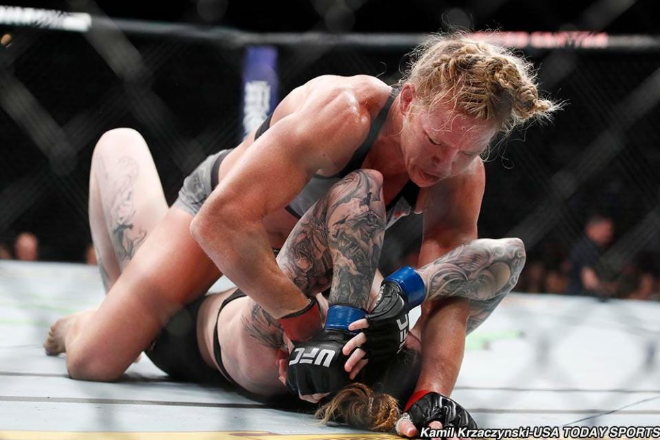 Jun 9, 2018; Chicago, IL, USA;  Holly Holm (red gloves) fights Megan Anderson (blue gloves) during UFC 225 at United Center. Mandatory Credit: Kamil Krzaczynski-USA TODAY Sports