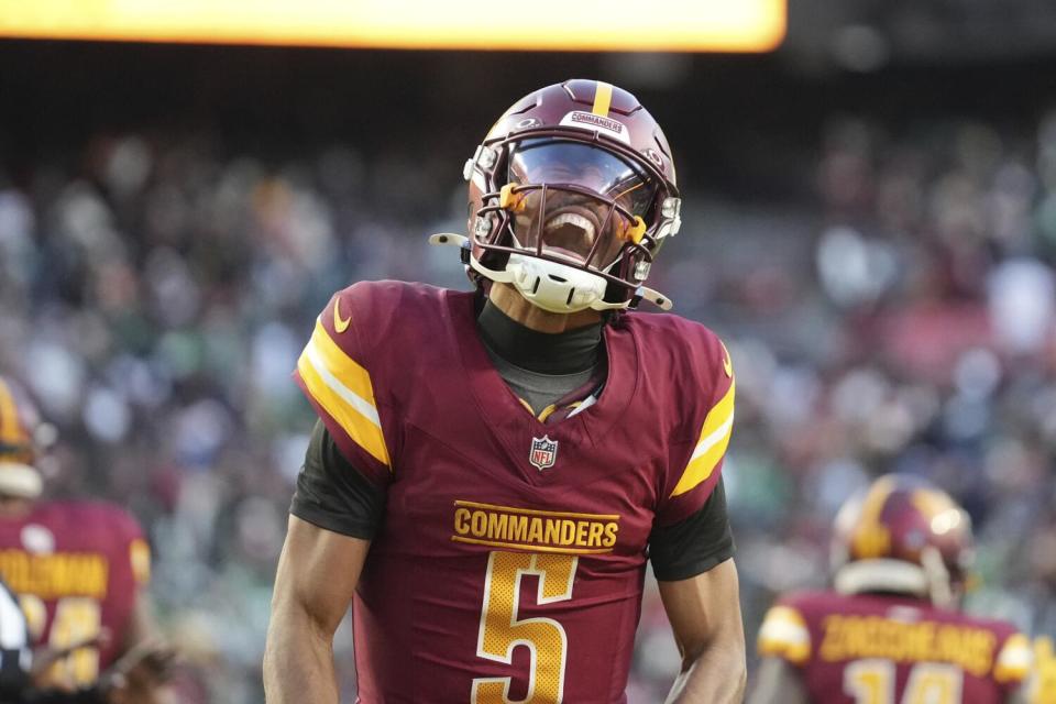 Commanders quarterback Jayden Daniels (5) celebrates after beating the Eagles in December.