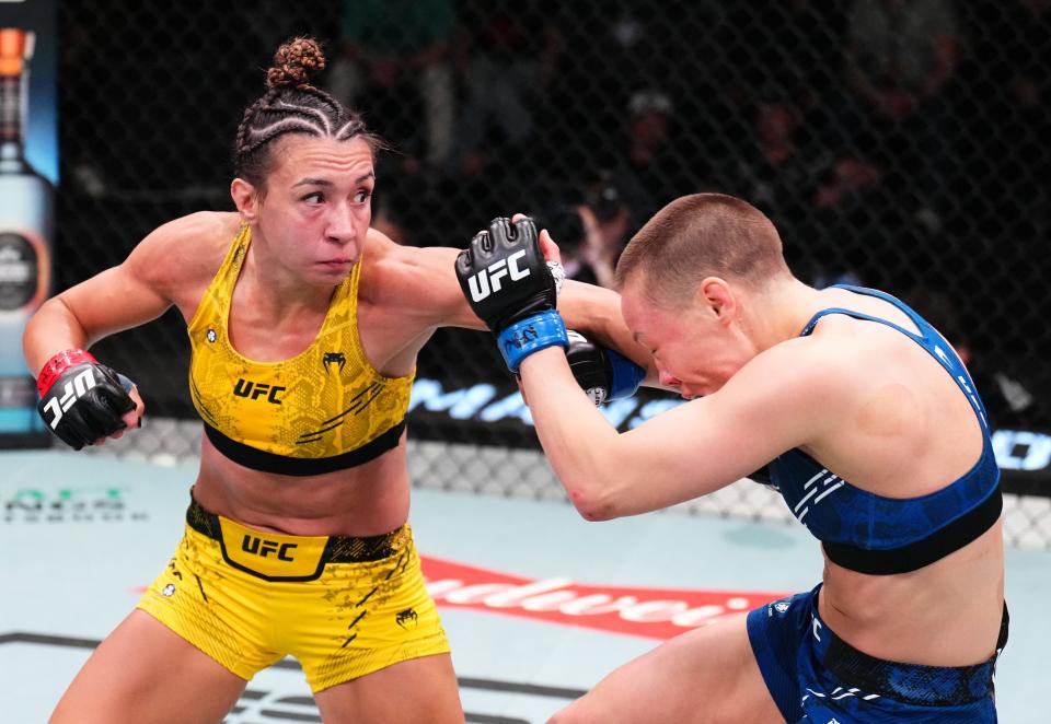 LAS VEGAS, NEVADA - MARCH 23: (L-R) Amanda Ribas of Brazil punches Rose Namajunas in a flyweight fight during the UFC Fight Night event at UFC APEX on March 23, 2024 in Las Vegas, Nevada. (Photo by Chris Unger/Zuffa LLC via Getty Images)