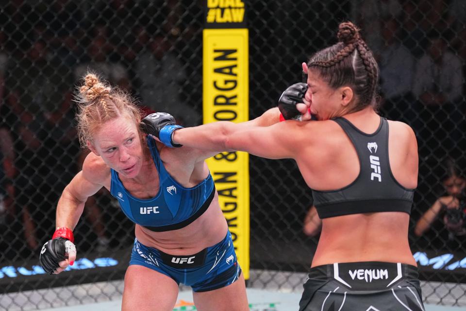 LAS VEGAS, NEVADA - JULY 15:  (L-R) Holly Holm punches Mayra Bueno Silva of Brazil in their women's bantamweight fight during the UFC Fight Night at UFC APEX on July 15, 2023 in Las Vegas, Nevada. (Photo by Jeff Bottari/Zuffa LLC via Getty Images)