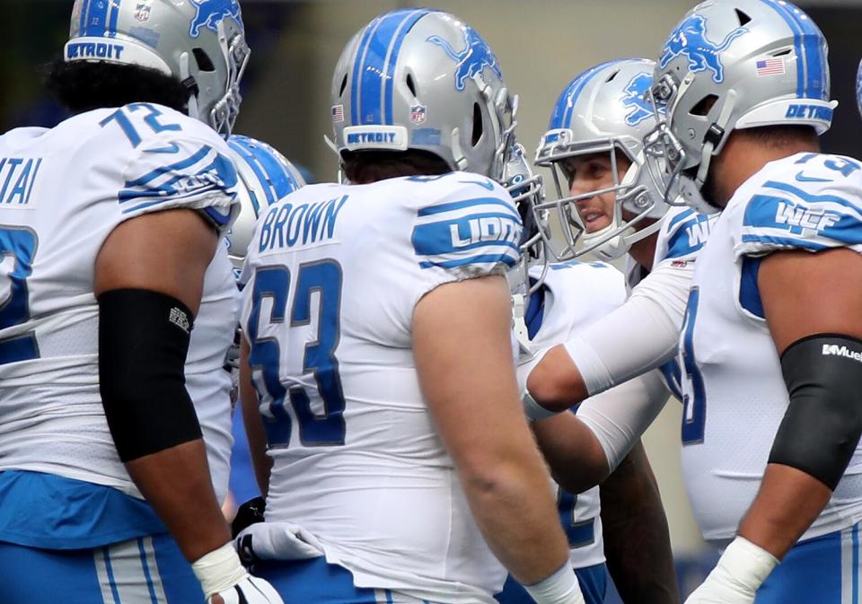 Quarterback Jared Goff calls a play in the Lions offensive huddle during a game at SoFi Stadium against the Rams in 2021.