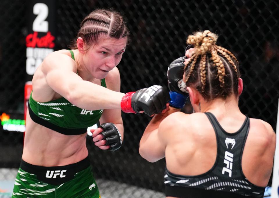 LAS VEGAS, NEVADA - JANUARY 11: (L-R) Ernesta Kareckaite of Lithuania punches Nicolle Caliari of Brazil in a flyweight fight during the UFC Fight Night event at UFC APEX on January 11, 2025 in Las Vegas, Nevada. (Photo by Chris Unger/Zuffa LLC via Getty Images)