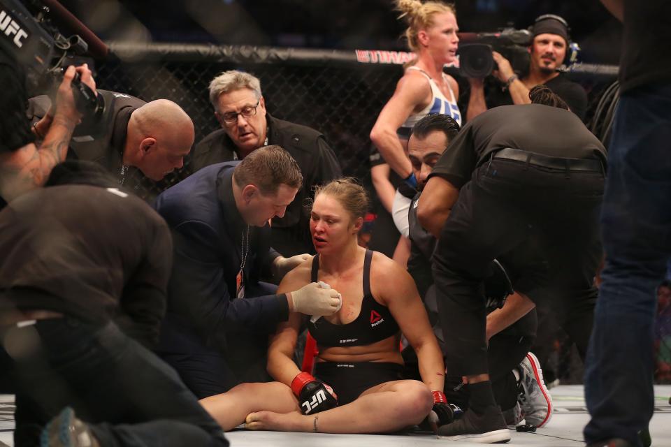 MELBOURNE, AUSTRALIA - NOVEMBER 15:  Ronda Rousey of the United States receives medical treatment after being defeated by Holly Holm of the United States in their UFC women's bantamweight championship bout during the UFC 193 event at Etihad Stadium on November 15, 2015 in Melbourne, Australia.  (Photo by Quinn Rooney/Getty Images)