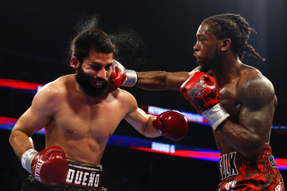 NEWARK, NEW JERSEY - JULY 06: Miguel Madueno of Mexico (black trunks) trades punches with Keyshawn Davis (red trunks) during their Lightweight fight at Prudential Center on July 06, 2024 in Newark, New Jersey. (Photo by Sarah Stier/Getty Images)