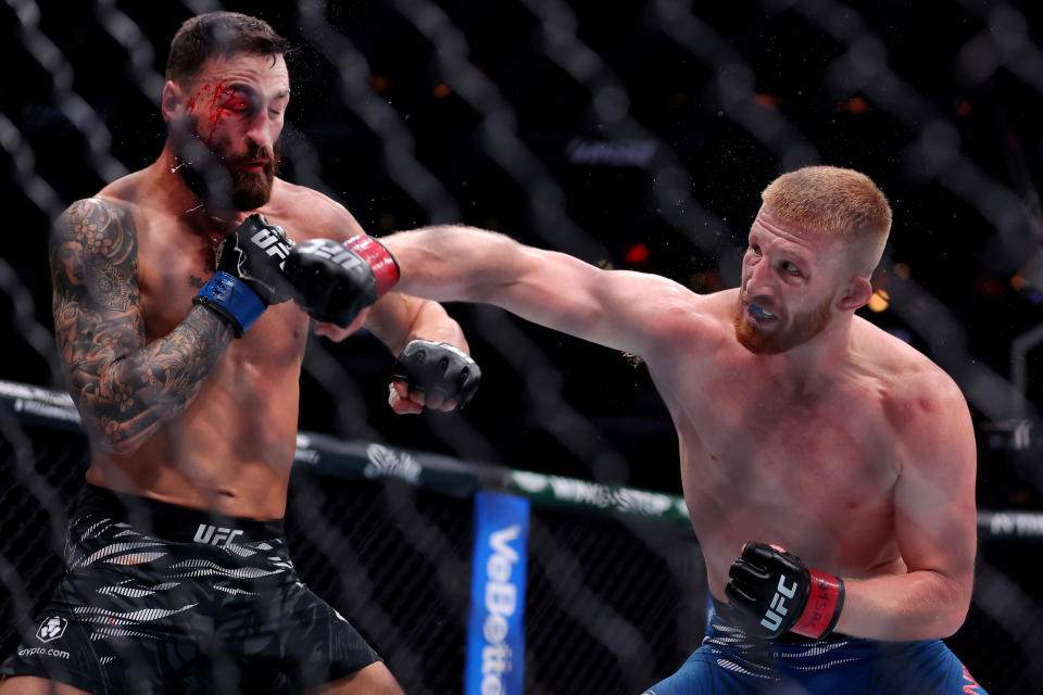 Nov 16, 2024; New York, NY, USA; Bo Nickal (red gloves) fights Paul Craig (blue gloves) in the middleweight bout during UFC 309 at Madison Square Garden. Mandatory Credit: Brad Penner-Imagn Images