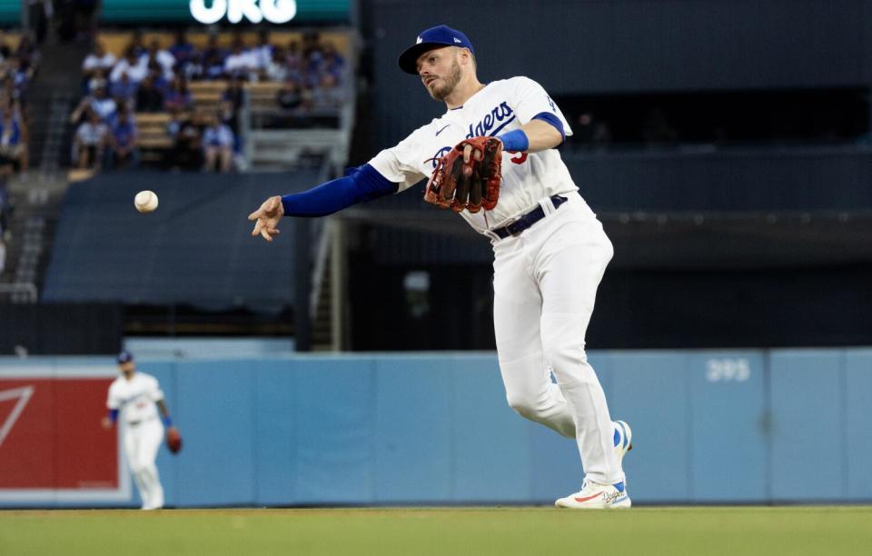 Dodgers second baseman Gavin Lux throws out a baserunner during a game against the Arizona Diamondbacks in July.