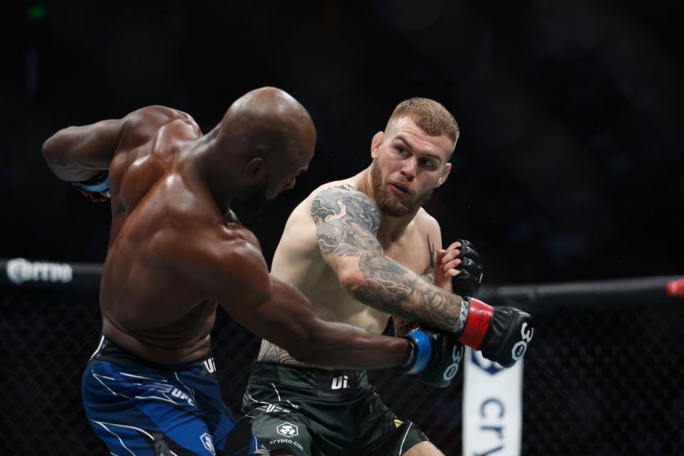 Jul 29, 2023; Salt Lake City, Utah, USA; Jake Matthews (red gloves) fights Darrius Flowers (blue gloves) during UFC 291 at Delta Center. Mandatory Credit: Jeff Swinger-USA TODAY Sports