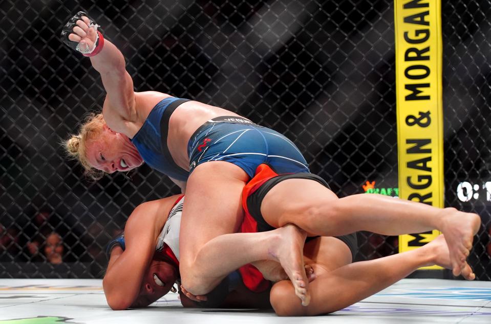 Mar 25, 2023; San Antonio, Texas, USA; Holly Holm (red gloves) fights Yana Santos (blue gloves) during UFC Fight Night at AT&T Center. Mandatory Credit: Aaron Meullion-USA TODAY Sports