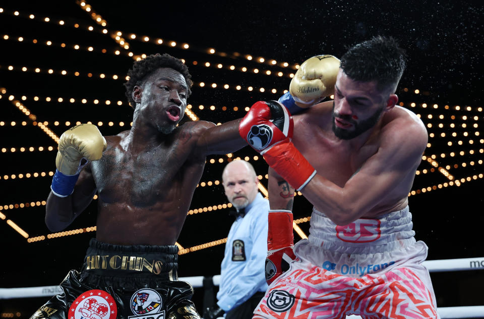 NEW YORK, NEW YORK - FEBRUARY 04:  Richardson Hitchins punches John Bauza during their Super Lightweight fight  at The Hulu Theater at Madison Square Garden on February 04, 2023 in New York City. (Photo by Al Bello/Getty Images)