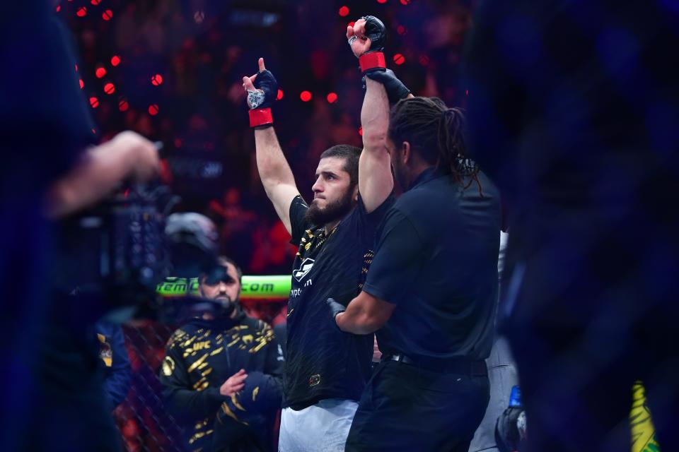 Jan 18, 2025; Inglewood, California, USA; Islam Makhachev (red gloves) reacts after defeating Renato Moicano (not pictured) in a lightweight title fight during UFC 311 at Intuit Dome. Mandatory Credit: Gary A. Vasquez-Imagn Images