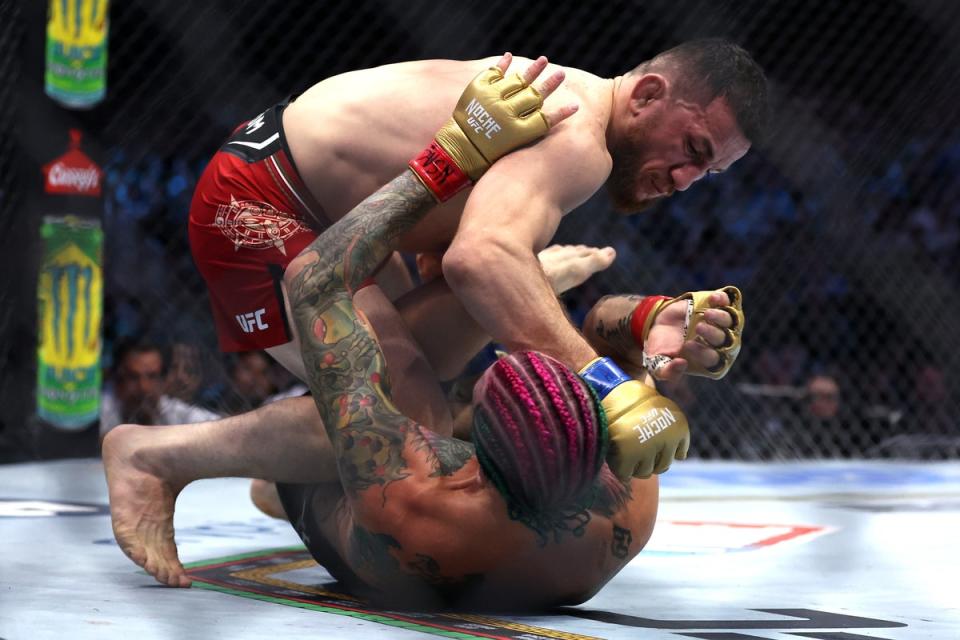 Merab Dvalishvili (top) dominated Sean O’Malley to take his bantamweight belt (Getty Images)