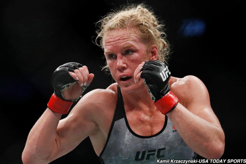 Jun 9, 2018; Chicago, IL, USA;  Holly Holm (red gloves) fights Megan Anderson (blue gloves) during UFC 225 at United Center. Mandatory Credit: Kamil Krzaczynski-USA TODAY Sports