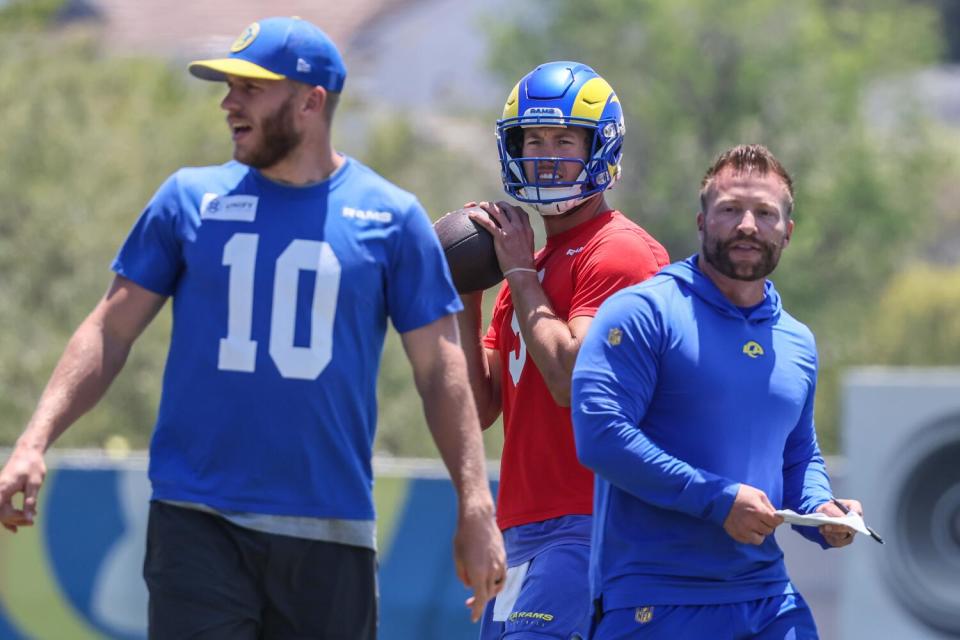 Rams quarterback Matthew Stafford is flanked by receiver Cooper Kupp and coach Sean McVay at practice.