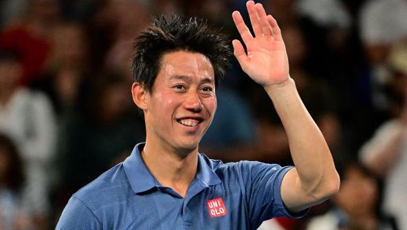 Kei Nishikori waves to the crowd after winning his Australian Open first round match