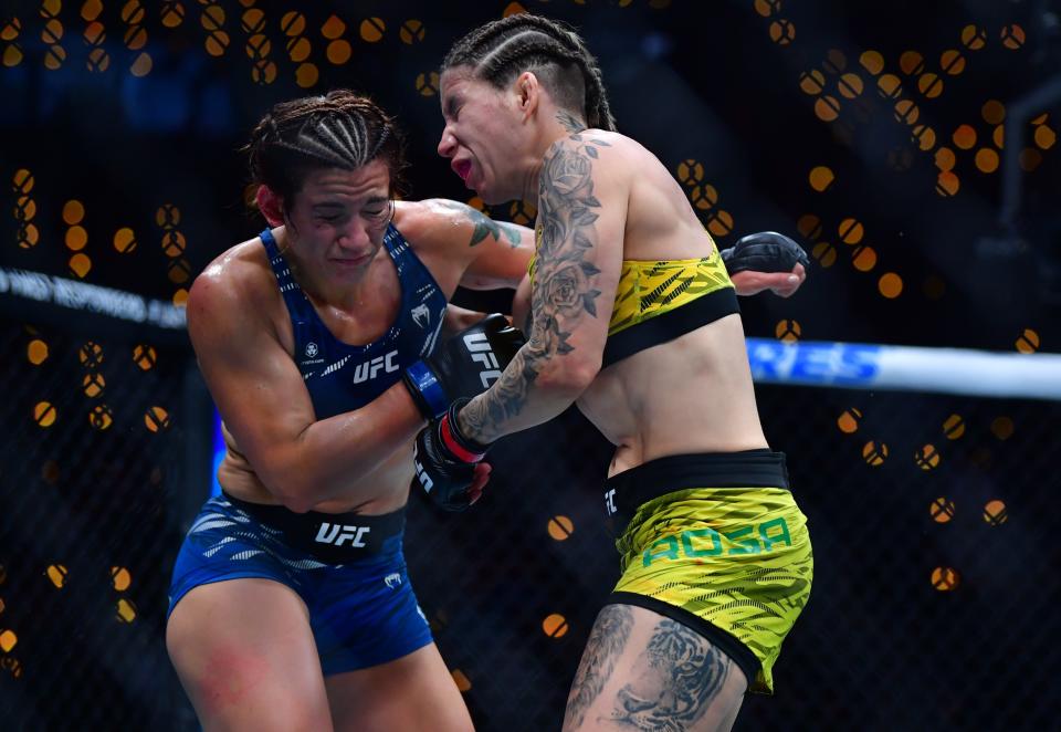 Jan 18, 2025; Inglewood, California, USA; Karol Rosa (red gloves) fights Ailin Perez (blue gloves) during UFC 311 at Intuit Dome. Mandatory Credit: Gary A. Vasquez-Imagn Images