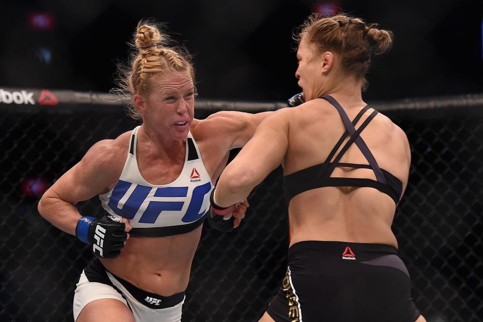 Nov 15, 2015; Melbourne, Australia; Ronda Rousey (red gloves) competes against Holly Holm (blue gloves) during UFC 193 at Etihad Stadium. Mandatory Credit: Matt Roberts-USA TODAY Sports