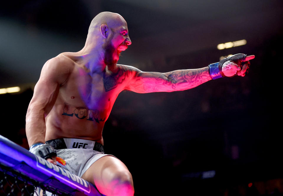 Jun 29, 2024; Las Vegas, Nevada, USA; Jean Silva (blue gloves) reacts after knocking out Charles Jourdain (not pictured) during UFC 303 at T-Mobile Arena. Mandatory Credit: Mark J. Rebilas-USA TODAY Sports