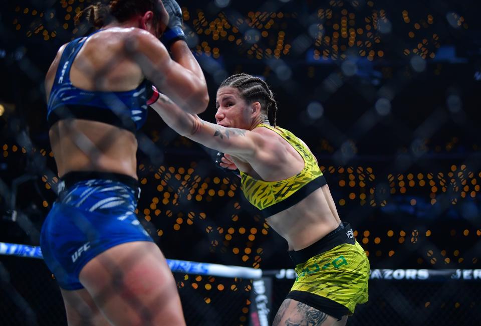 Jan 18, 2025; Inglewood, California, USA; Karol Rosa (red gloves) fights Ailin Perez (blue gloves) during UFC 311 at Intuit Dome. Mandatory Credit: Gary A. Vasquez-Imagn Images