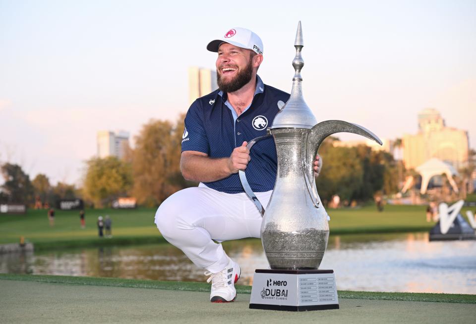 Tyrrell Hatton poses with the trophy following victory on day four of the Hero Dubai Desert Classic at Emirates Golf Club on January 19, 2025 in Dubai, United Arab Emirates.