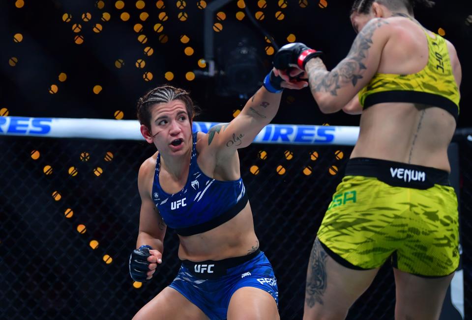 Jan 18, 2025; Inglewood, California, USA; Karol Rosa (red gloves) fights Ailin Perez (blue gloves) during UFC 311 at Intuit Dome. Mandatory Credit: Gary A. Vasquez-Imagn Images