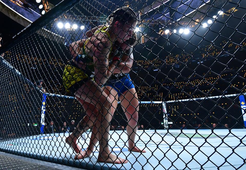 Jan 18, 2025; Inglewood, California, USA; Karol Rosa (red gloves) fights Ailin Perez (blue gloves) during UFC 311 at Intuit Dome. Mandatory Credit: Gary A. Vasquez-Imagn Images