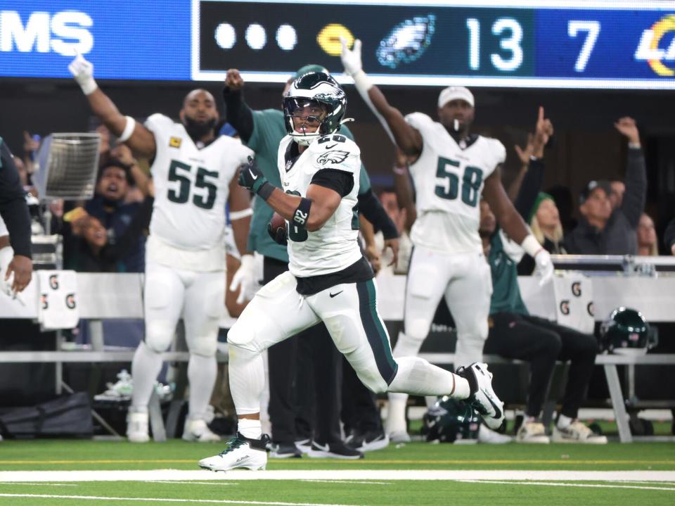 Eagles running back Saquon Barkley runs 70 yards for touchdown on the first play of the second half against the Rams.