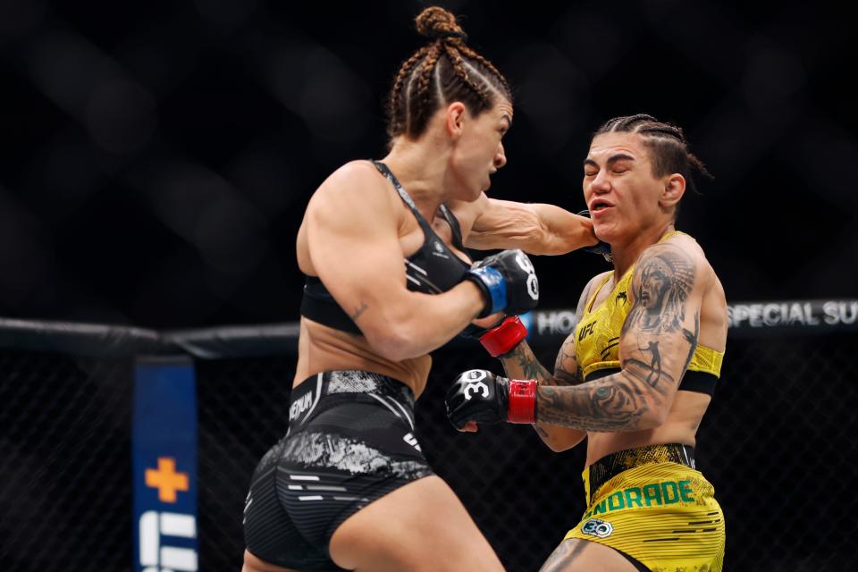 NEW YORK, NEW YORK - NOVEMBER 11: Mackenzie Dern punches Jessica Andrade of Brazil in a strawweight fight during the UFC 295 event at Madison Square Garden on November 11, 2023 in New York City. (Photo by Sarah Stier/Getty Images)